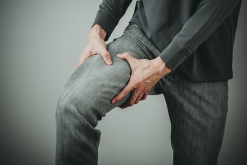 man thigh pain from cramp - obrazy, fototapety, plakaty