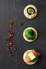 Homemade pancake canapes on slate stone plate for finger food party