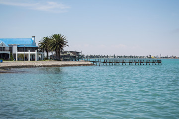 Bay with Turquoise Sea and a Pier in Walvisbay, Namibia