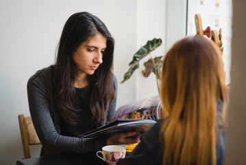Girls in a cafe talking