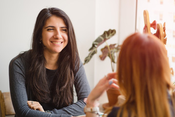 Girls in a cafe talking