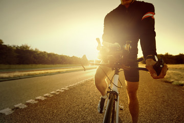 Fototapeta na wymiar Bicycle sportsman standing parked on empty highway