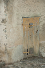 An old weathered door to a stone house