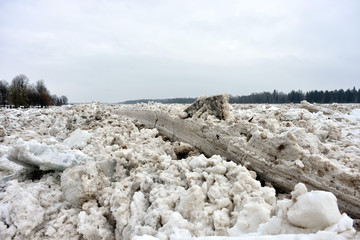Spring flood threat. The ice jam on the river.