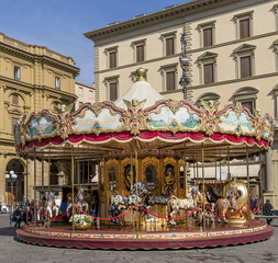 The ancient children's carousel in Piazza della Repubblica square in the historic center of Florence Italy © Marco Taliani