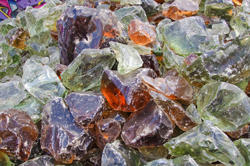 A pile of pieces of colored glass melted. Background, texture