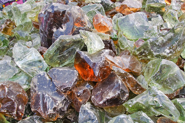 A pile of pieces of colored glass melted. Background, texture