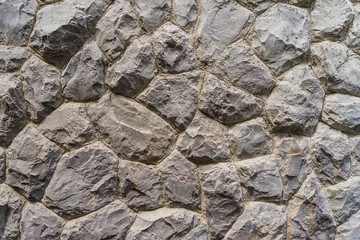 Rough stone of different shades, Stacked Stone Wall