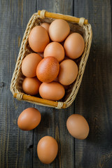 chicken eggs on wooden background