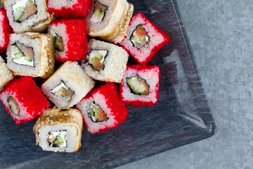 Sushi rolls on a glass plate