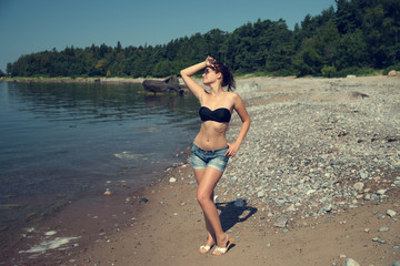 Fototapeta premium portrait beautiful smiling woman in black bikini