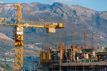 Construction of a multi-storey building. The crane is working. Budva, Montenegro.