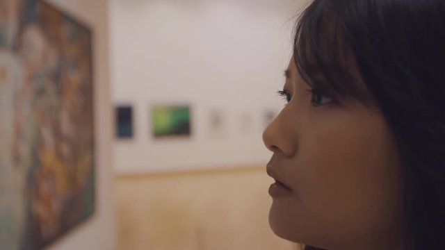 woman visiting art gallery