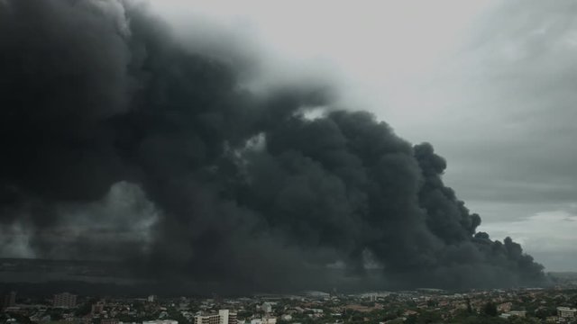 Environmental Emergency: Durban Shrouded in Thick Black Smoke from a Massive Explosion at an Oil Refinery.