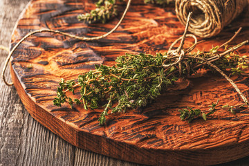 Thyme on old wooden board