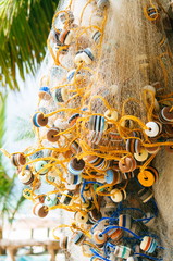 Hanging fishing nets on the palms