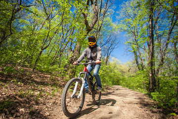 Fototapeta na wymiar man ride mountain bike through forest