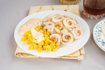 Squid salad with egg, onion, corn and sauce