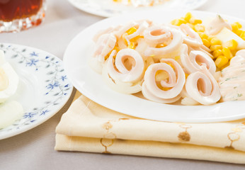 Squid salad with egg, onion, corn and sauce