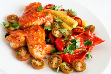 garnished with colourful vegetables roasted chicken wings (marinated in hot tomato garlic sauce)