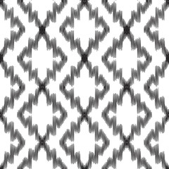 Vector illustration of black and white colored Ikat seamless pattern. Scribble textured.