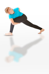 beautiful woman doing yoga on white background