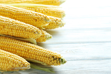 Sweet corns on a white wooden table