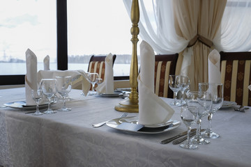 Interior of a cafe with the serviced tables