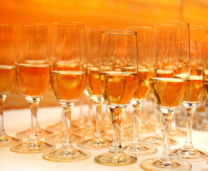 The order of wine glasses on an amber background
