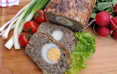 Baked meatloaf with boiled eggs