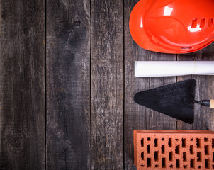 Construction tools on wooden background