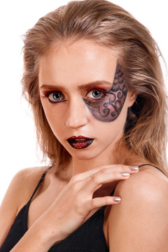 Beauty portrait of a young girl with a scales makeup