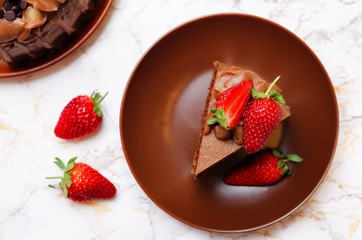 Chocolate cake decorated with strawberries