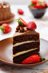 Chocolate cake decorated with strawberries