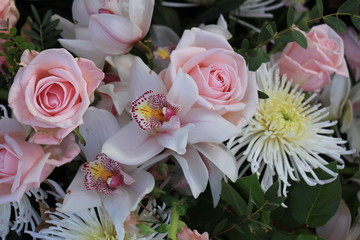 Pink roses and Cymbidium orchids