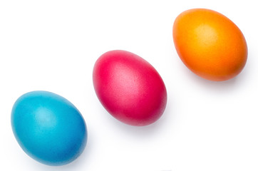 three colored eggs, isolated on white backgroung