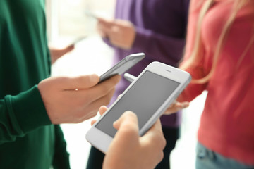 Female hand with smartphone, closeup