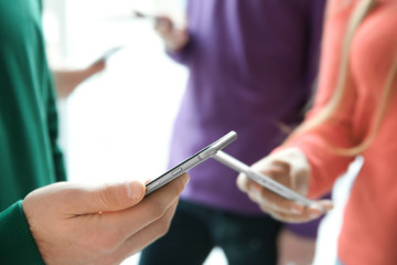 Male hand with smartphone, closeup