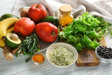 Set of healthy products on white wooden background
