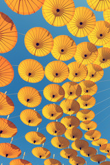 Fototapeta na wymiar Decoration by colorful umbrella with sky background.