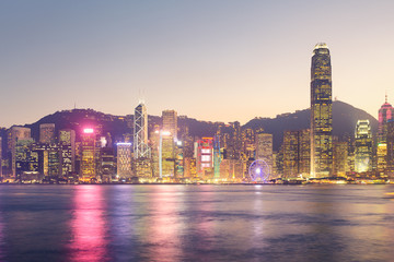 Cityscape and skyline at Victoria Harbour in Hong Kong city at twilight time.