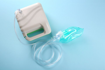 Nebulizer for asthma and respiratory diseases on light background