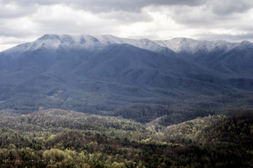 Obraz premium Snow capped mountains and green valley in the Smokies.