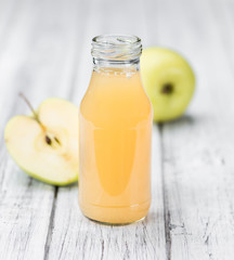 Apple Juice on vintage wooden background