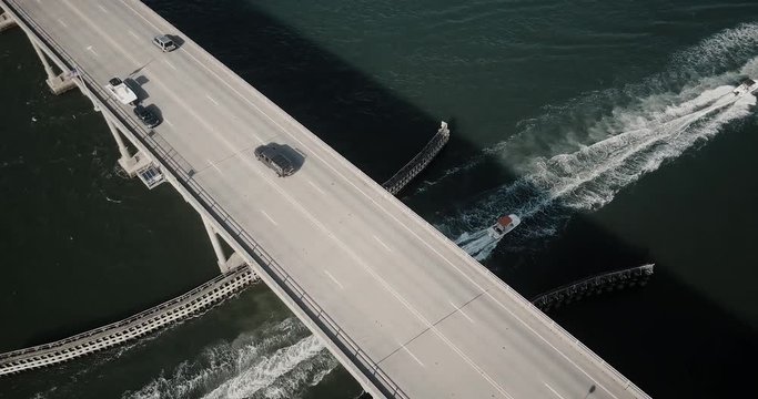 Boats and cars across bridge aerial photography