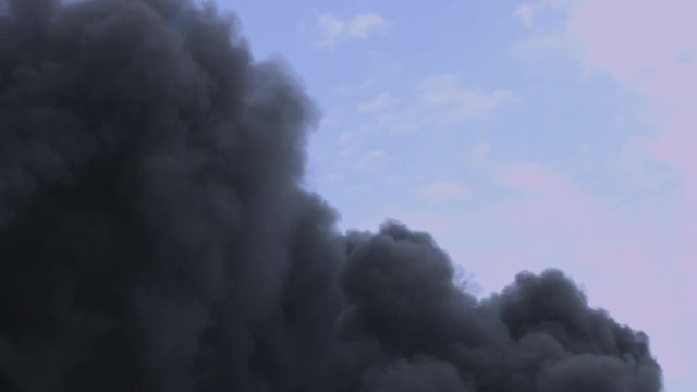 Thick Black Smoke: Industrial Pollution Crisis Unfolds in Sky's Toxic Clouds.