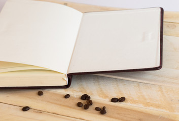 Mix of office supplies and gadgets on a wooden table background. View from above.