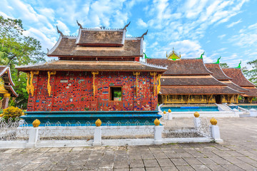 Wat Xieng Thong in Luang Prabang, Laos Heritage state at Wat Xieng Thong Luang Prabang Laos, Flowers in front of Wat Thong Xieng temple