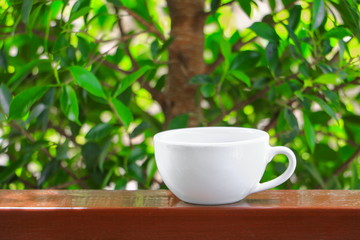 coffee cup  on  wood floor background