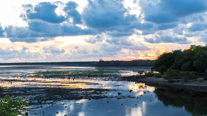 Tropical Sunset on the lake on Bali island, Indonesia.